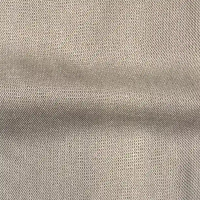 Close-up of Longan Craft’s Solid Color Denim Lyocell Fabric By The Yard, showcasing its diagonal twill weave and breathable, wrinkle-free texture—ideal for comfy jeans or sustainable fashion projects.