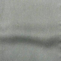 Close-up of Longan Craft’s Solid Color Denim Lyocell Fabric By The Yard—a light gray, wrinkle-free, breathable textile with a diagonal twill weave, ideal for comfy jeans and sustainable fashion projects.