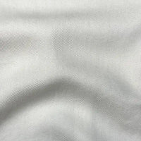 Close-up of Longan Craft’s Solid Color Denim Lyocell Fabric by the yard, featuring a smooth, wrinkle-free texture and subtle diagonal weave—breathable and comfy for sustainable jeans and fashion.