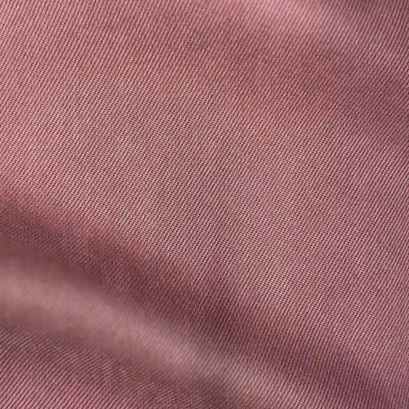 Close-up of Longan Craft's Solid Color Denim Lyocell Fabric by the yard—a breathable, wrinkle-free textile with a soft sheen and subtle texture, perfect for comfy jeans and sustainable fashion projects.
