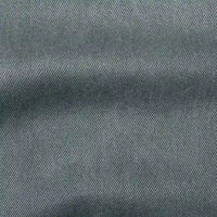 Close-up of Longan Craft’s Solid Color Denim Lyocell Fabric By The Yard shows its diagonal twill weave, subtle texture, and color variation—this wrinkle-free, breathable material is ideal for comfy, sustainable jeans or fashion projects.