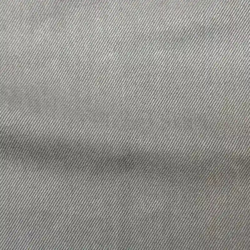 Close-up of Longan Craft’s Solid Color Denim Lyocell Fabric by the yard, featuring a subtle diagonal weave and fine texture—wrinkle-free, breathable, and comfy material, ideal for sustainable jeans and fashion projects.
