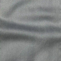 Close-up of Longan Craft’s Solid Color Denim Lyocell Fabric by the Yard—wrinkle-free, breathable, and comfy material with fine diagonal weave, ideal for sustainable jeans and fashion projects.