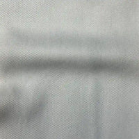 Close-up of Longan Craft Solid Color Denim Lyocell Fabric by the yard—a wrinkle-free, breathable, and comfy lyocell textile with a subtle diagonal twill pattern, ideal for sustainable fashion and perfect for making jeans.