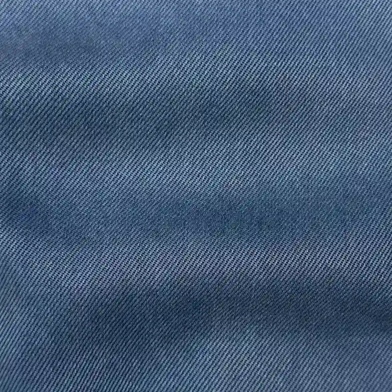 Close-up of Longan Craft's Solid Color Denim Lyocell Fabric By The Yard, highlighting its breathable, wrinkle-free diagonal weave and soft textured surface—ideal comfy lyocell material for jeans and more.