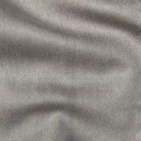 Close-up of Longan Craft's Solid Color Denim Lyocell Fabric By The Yard in light gray, highlighting its breathable, wrinkle-free texture and subtle diagonal weave—perfect for comfy jeans and other apparel.
