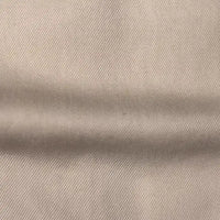 Close-up of Longan Craft’s Solid Color Denim Lyocell Fabric By The Yard shows its visible diagonal weave and horizontal fold, highlighting this wrinkle-free, breathable textile—perfect for stylish and sustainable jeans.