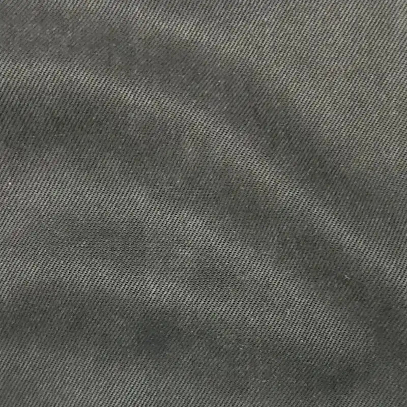 Close-up of Longan Craft’s Solid Color Denim Lyocell Fabric by the yard, featuring wrinkle-free, breathable, and comfy material with a dark gray diagonal ribbed twill texture—ideal for jeans and apparel.