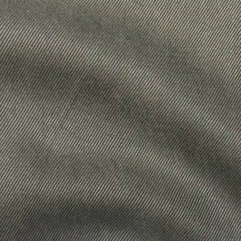 Close-up of Longan Craft Solid Color Denim Lyocell Fabric by the yard, featuring a taupe breathable, wrinkle-free denim material with a diagonal twill weave—ideal for comfy, sustainable jeans and fashion projects.