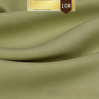 Close-up of Longan Craft’s Solid Color Linen Lyocell Fabric By The Yard in light olive green (color code 10#), showing its smooth, slightly textured surface and gentle drape. This sustainable, wrinkle-free twill is ideal for dresses.
