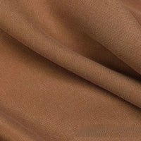 Close-up of Longan Craft Solid Color Linen Lyocell Fabric by the Yard, featuring a brown wrinkle-free twill weave with smooth texture and gentle folds—sustainable and breathable material perfect for dresses.