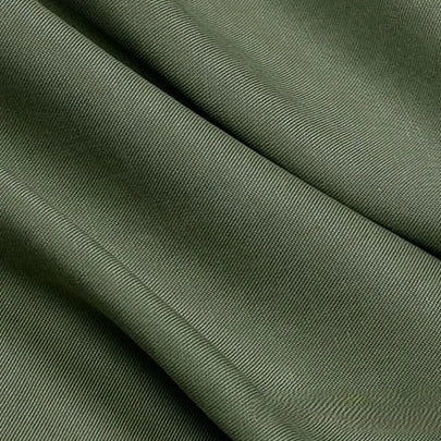 Close-up of Longan Craft’s Solid Color Linen Lyocell Fabric By The Yard features olive green, wrinkle-free twill with visible diagonal ribbing, soft flowing folds, and a smooth yet slightly textured sustainable surface.