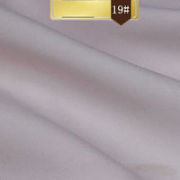 Smooth, light lavender Solid Color Linen Lyocell Fabric by Longan Craft, sustainable and wrinkle-free twill with a subtle sheen and diagonal weave, labeled “19#” on a gold and brown tag at the top—ideal for dresses.
