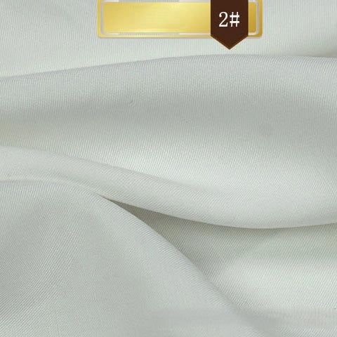 A close-up of Longan Craft's Solid Color Linen Lyocell Fabric shows its smooth, white, sustainable material with soft folds. At the top, a gold label marked 2# is displayed.