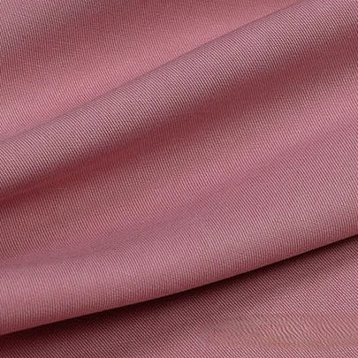 Close-up of Longan Craft's Solid Color Linen Lyocell Fabric By The Yard, a sustainable, wrinkle-free twill material with a subtle diagonal weave and gentle folds, highlighting its smooth texture and breathable finish, perfect for dresses.