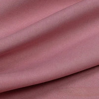 Close-up of Longan Craft's Solid Color Linen Lyocell Fabric By The Yard, a sustainable, wrinkle-free twill material with a subtle diagonal weave and gentle folds, highlighting its smooth texture and breathable finish, perfect for dresses.