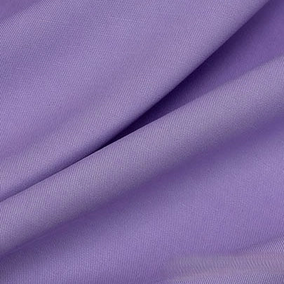 Close-up of Longan Craft’s Solid Color Linen Lyocell Fabric by the Yard—a wrinkle-free, lilac twill lyocell textile with visible diagonal folds and a soft, smooth texture, ideal for sustainable and breathable dresses.