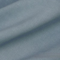 Close-up of Longan Craft’s Solid Color Linen Lyocell Fabric By The Yard, a sustainable wrinkle-free twill material in light blue, showing its diagonal weave, soft folds, and breathable texture—ideal for dresses.