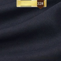 Close-up of Longan Craft’s Solid Color Linen Lyocell Fabric in dark navy, featuring a gold and brown "32#" label. This sustainable, wrinkle-free fabric is breathable and ideal for eco-friendly dresses.