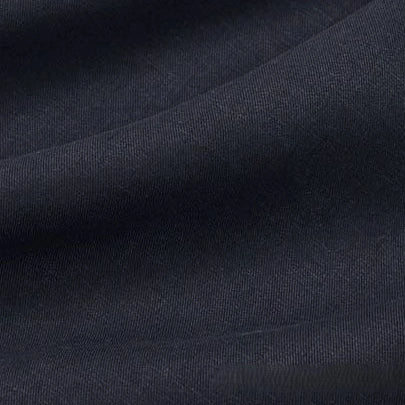 Close-up of dark gray Solid Color Linen Lyocell Fabric by Longan Craft, showing its visible texture and gentle folds. This wrinkle-free, sustainable twill lyocell material is breathable and ideal for dresses.