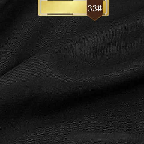 Close-up of black Longan Craft Solid Color Linen Lyocell Fabric, featuring a smooth texture and a gold label at the top marked with 33#.