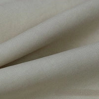 A close-up of Longan Craft’s Solid Color Linen Lyocell Fabric By The Yard reveals its smooth, wrinkle-free twill texture, subtle diagonal weave, and gentle folds—an eco-friendly, breathable material ideal for dresses.