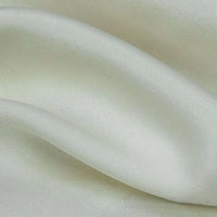 Close-up of Longan Craft's Solid Color Linen Lyocell Fabric by the Yard, a sustainable, wrinkle-free twill lyocell textile with gentle folds, soft sheen, and elegant drape—perfect for breathable dresses.