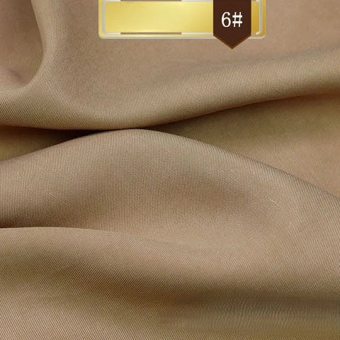 Close-up of Longan Craft’s Solid Color Linen Lyocell Fabric By The Yard in light brown, showing its smooth, slightly shiny wrinkle-free twill texture and visible weave. A gold bar label with “6#” appears at the top. Sustainable, breathable, ideal for dresses.