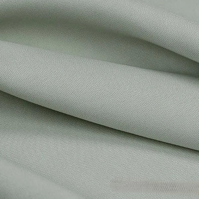 Close-up of Longan Craft's Solid Color Linen Lyocell Fabric by the Yard, a smooth, wrinkle-free twill material with soft folds and slight sheen—sustainable and breathable for dresses.