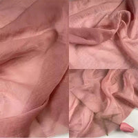 Longan Craft’s Solid Color Linen Silk Fabric by the yard is a sheer, lightweight lyocell silk blend in pink, shown close-up to highlight its soft, translucent texture and subtle draping—perfect for luxurious silk upholstery projects.