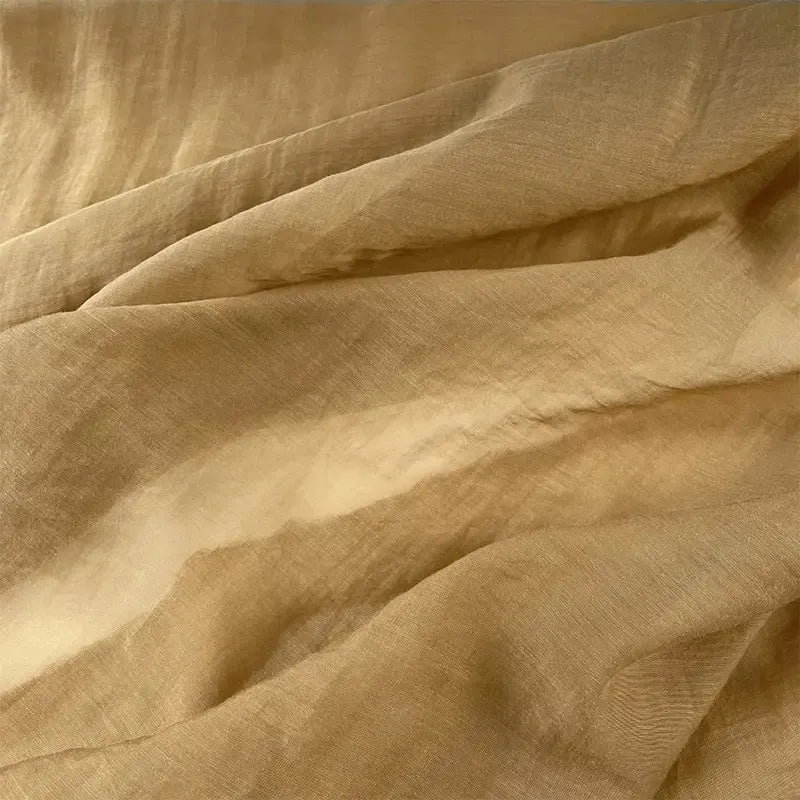 Close-up of Longan Craft’s Solid Color Linen Silk Fabric By The Yard, a thin lyocell silk blend material with soft folds and textured surface—ideal as perfect silk upholstery fabric.