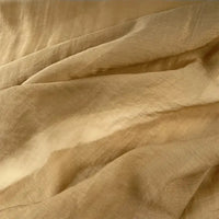 Close-up of Longan Craft’s Solid Color Linen Silk Fabric By The Yard, a thin lyocell silk blend material with soft folds and textured surface—ideal as perfect silk upholstery fabric.