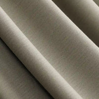 Close-up of Longan Craft’s Solid Color Modal Jersey Fabric by the yard shows its light brown, matte finish and fine soft texture. This cotton spandex jersey fabric is breathable and ideal for sleepwear, with gentle folds highlighting its elegant drape.