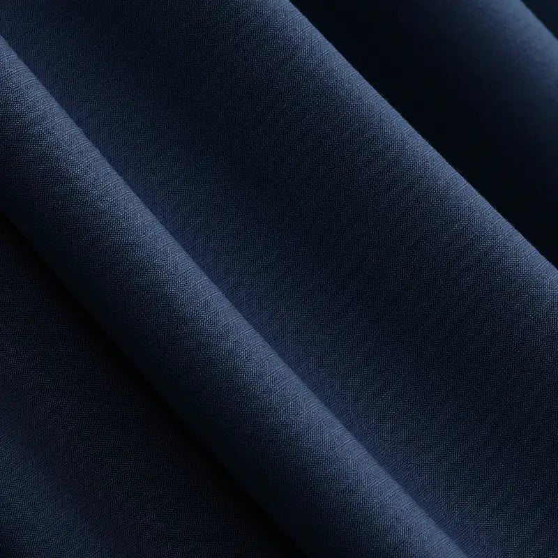 Close-up of Longan Craft’s Solid Color Modal Jersey Fabric by the yard in dark navy blue, a breathable cotton spandex textile with a smooth, matte finish—ideal for children’s clothing and sleepwear.
