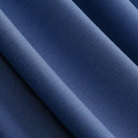 Close-up of smooth, folded Solid Color Modal Jersey Fabric by Longan Craft in navy blue, showing its soft texture, subtle sheen, and diagonal folds—ideal breathable cotton spandex jersey textile for sleepwear.