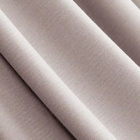 Close-up of Longan Craft’s Solid Color Modal Jersey Fabric by the Yard, a soft, light beige cotton spandex jersey with smooth texture and subtle sheen—ideal breathable textile for comfortable sleepwear creations.