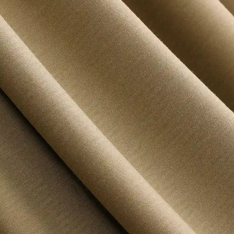 Close-up of smooth, light brown Solid Color Modal Jersey Fabric by Longan Craft, featuring a subtle texture and gentle folds—this breathable cotton spandex jersey is ideal for children's clothing and perfect for sleepwear.