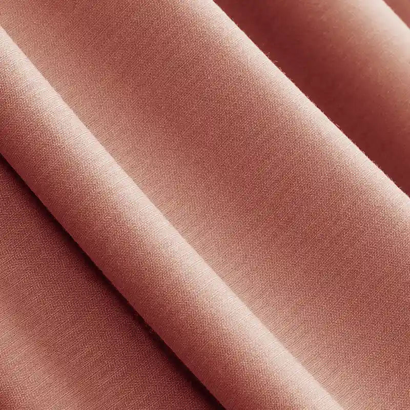 Close-up of Longan Craft Solid Color Modal Jersey Fabric by the yard in a muted rose, showing its soft, smooth texture and matte finish—an ideal breathable cotton spandex jersey textile for children's sleepwear and clothing projects.
