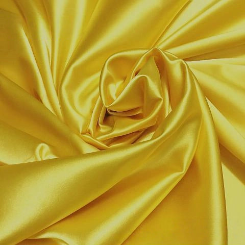 Longan Craft's Solid Color Polyester Satin Fabric By The Yard features a silky stretch satin texture in vibrant yellow, arranged in gentle folds that showcase its soft, glossy finish and elegant highlights—ideal for blouses.