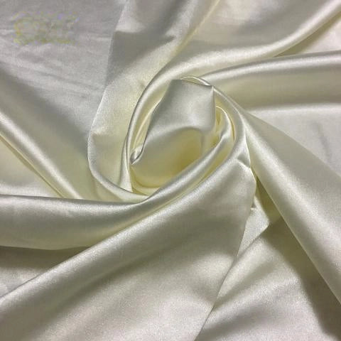 Longan Craft’s Solid Color Polyester Satin Fabric By The Yard features a silky stretch texture and smooth cream color with a gentle sheen, perfect for blouses and luxurious projects.
