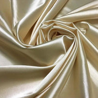 Longan Craft’s Solid Color Polyester Satin Fabric by the Yard features a silky stretch satin texture with a shiny, light gold surface and soft, luxurious feel—ideal for blouses and perfect for elegant draping.