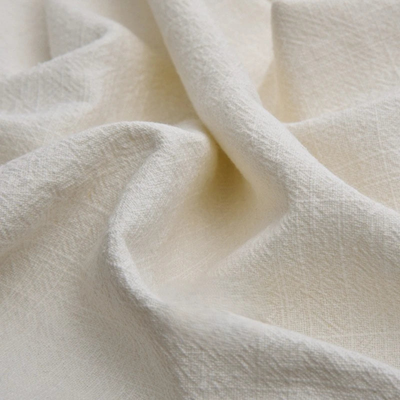 A detailed view of Longan Craft's Solid Color Rayon Linen Fabric By The Yard shows its thick, washed slub viscose texture with visible weave and soft folds—ideal for dresses and garments.