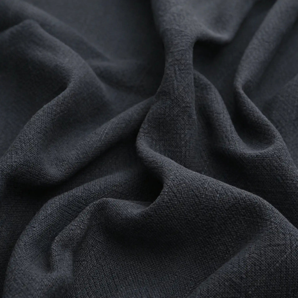 Close-up of Longan Craft Solid Color Rayon Linen Fabric By The Yard, a thick, washed slub viscose material with gentle folds and a soft, textured surface—ideal for dresses and clothing.