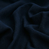Close-up of Longan Craft’s Solid Color Rayon Linen Fabric By The Yard—thick washed slub viscose with a soft, textured surface and visible folds, ideal for dresses and clothing.