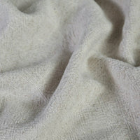 A close-up of Longan Craft’s Solid Color Rayon Linen Fabric by the yard, a thick washed slub viscose material with a soft, textured surface and visible woven fibers—ideal for dresses and clothing projects.