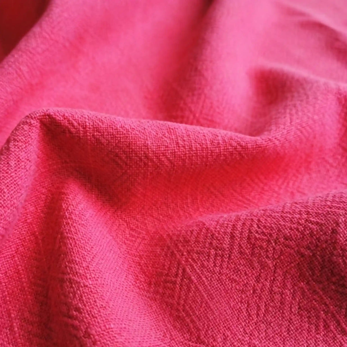 A close-up of Longan Craft’s Solid Color Rayon Linen Fabric by the Yard shows its thick washed slub texture, soft folds, and gentle shadows—perfect viscose material for dresses and clothing.