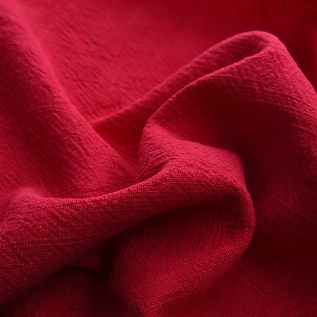 Close-up of Longan Craft's Solid Color Rayon Linen Fabric By The Yard, a thick washed slub viscose material with a soft, textured surface and visible folds, perfect for dresses and clothing projects.