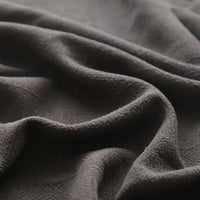 Close-up of Longan Craft's Solid Color Rayon Linen Fabric By The Yard, a thick, washed slub viscose material with a soft, textured woven surface and gentle folds, perfect for dresses and clothing projects.