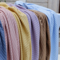 Longan Craft’s Solid Color Ribbed Viscose Fabric By The Yard features soft, stretchy material in blue, pink, yellow, purple, brown, and light blue—perfect for comfy DIY T-shirts or dresses.