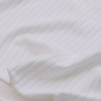 Close-up of Longan Craft’s Solid Color Ribbed Viscose Fabric by the Yard, featuring soft textured stretch elastane material with subtle pinstripes—ideal comfy textile for DIY t-shirts.
